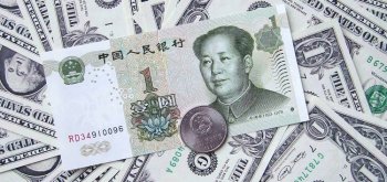 Китай снижает курс юаня